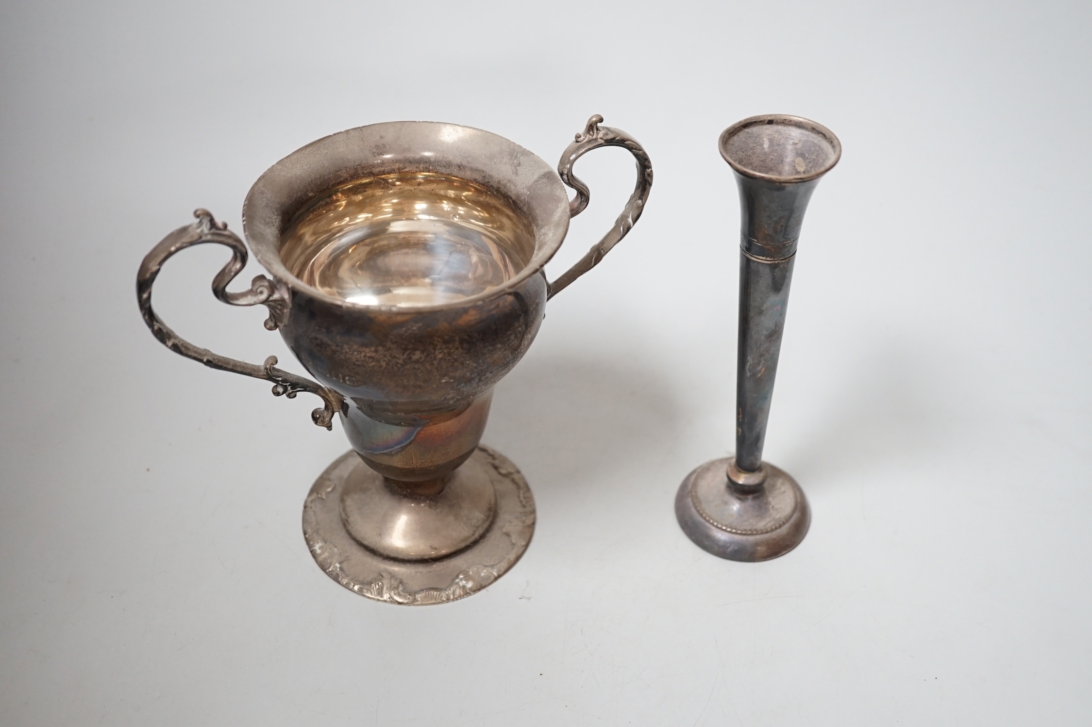 A George V silver two handled vase, Goldsmiths & Silversmiths Co Ltd, London, 1932, 16.2cm, 10oz and a spill vase.